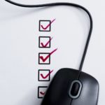 Computer mouse connected to row of checklist with checkbox.