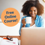 Woman sat at laptop with cup of tea taking part in a free online course.
